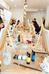 Women enjoying sip and paint art workshop