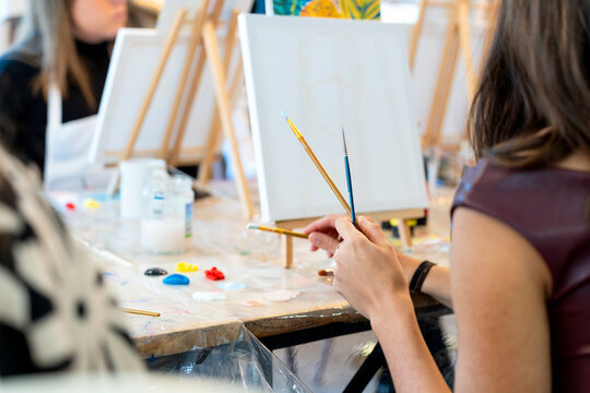 Women learning painting during a creative art workshop