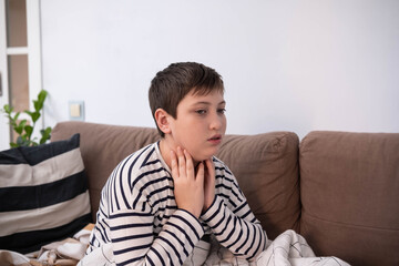 Sick boy touching neck unwell coughing with sore throat pain,bronchitis,Bronchial Asthma,Tuberculosis,pneumonia,covid-19,eco air pollution pm2.5.insurance and hospital