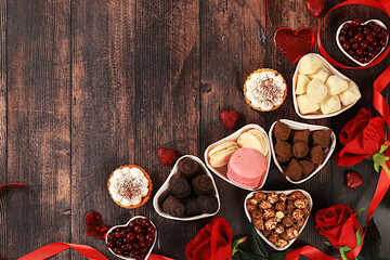 Food for Valentine's Day or Women's Day, Gourmet heart shaped chocolate candies, sugar cranberry, meringue and rose flowers, greeting card, advertising banner or store invitation.