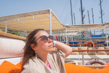 Enjoying time on a resort boat under the sun with a view of the sea on a warm day