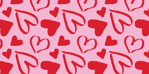 Seamless abstract pattern of hand drawn red hearts on a pink background. Vector illustration for for Valentine's Day, wedding invitations 