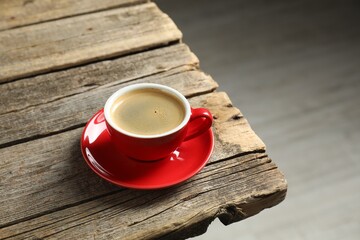 Obraz premium Cup of aromatic coffee on wooden table indoors. Space for text