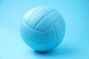 One volleyball ball on light blue background