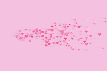 A beautiful array of delicate pink and red hearts scattered gracefully across a gentle background