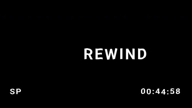 Rewind Rew VHS tape with glitch on black background. 4K video quality for editing.