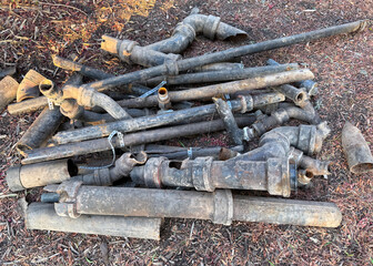 Old broken water pipes at a construction site
