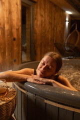 Relaxation in a wooden hot tub with a scenic ambiance