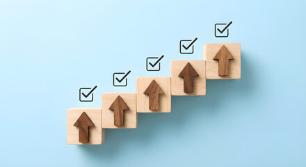 wooden blocks with arrows and checkmarks on blue background