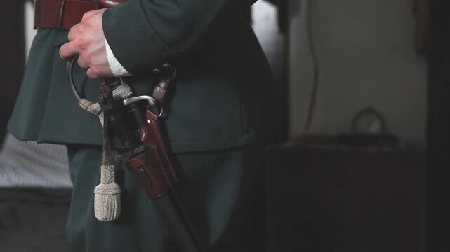 Details of policeman in uniform of 1920s in slow motion