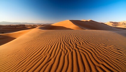 Textured Sand Dunes Form Wavy Patterns With Shadows Highlighting Ridges In A Desert Landscape