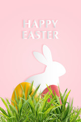 Holiday background with Easter colorful eggs in grass