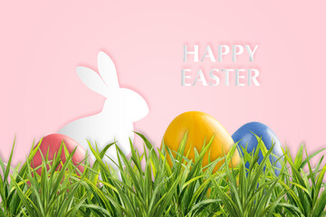 Holiday background with Easter colorful eggs in grass
