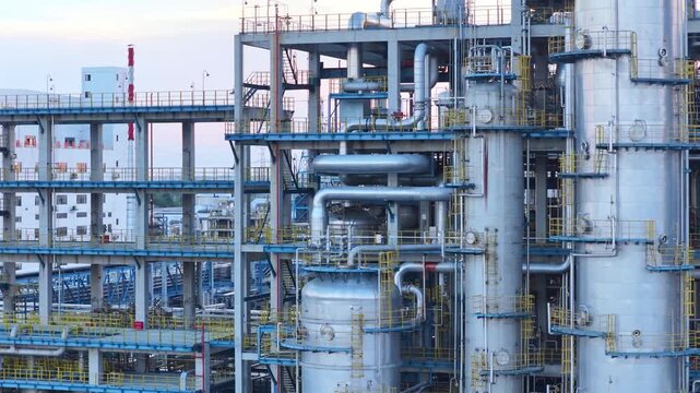 Aerial View of Industrial Oil Refinery with Storage Tanks and Pipelines