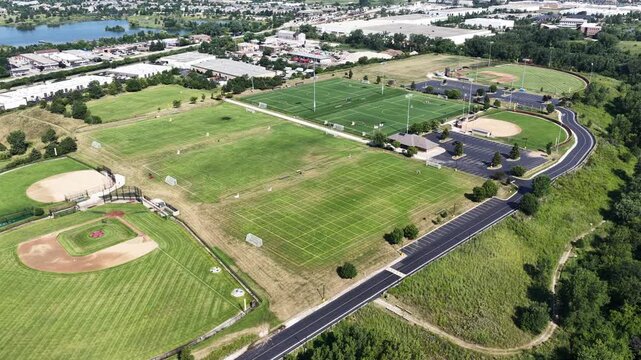 Aerial view of a sports field with soccer fields, baseball and softball fields in a suburban setting