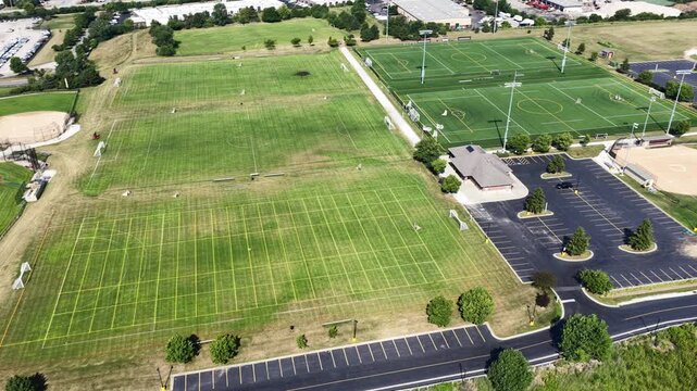 Aerial view of a sports field with soccer fields, baseball and softball fields in a suburban setting
