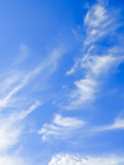 Blue sky with soft white clouds natural background