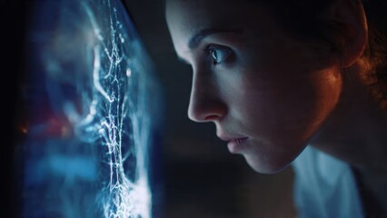 Woman intently viewing a brain scan