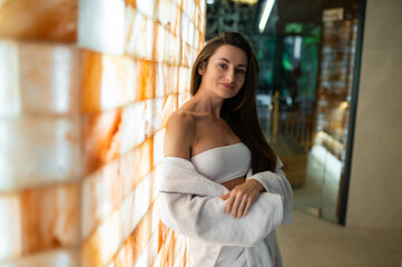 Long-haired pretty young woman in a spa center