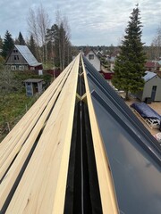 ridge of the roof of a rural house under construction, top view