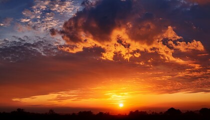 Naklejka premium A Bright And Beautiful Orange Sky With Clouds At Dawn Creates A Heavenly Backdrop For The Sunrise