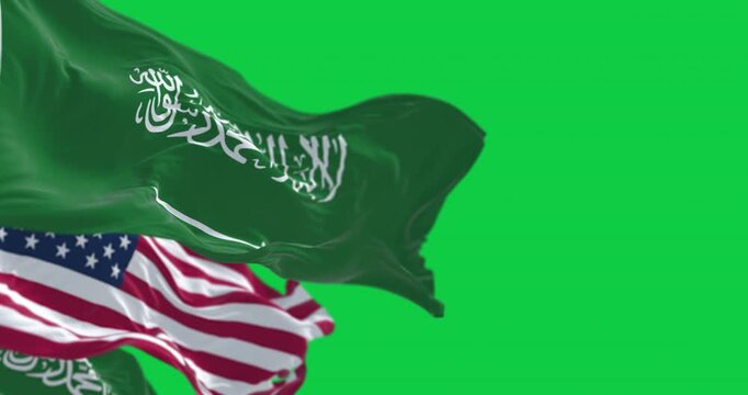 Saudi Arabian and American flags waving together isolated on green background