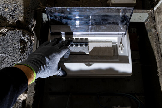 Old electrical fuse box on the basement wall, power outage repair in an old house, power outage,