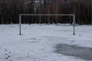 Empty Football Goal on Snowy Field in Winter Park