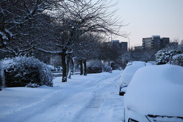 Aberdeen Scotland 5 January 2026 residential Road covered in snow.Cars on the side covered in snow. Photo taken in the morning .Urban life scene