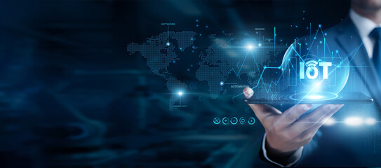 Fototapeta premium Businessman using the tab and analyzing IoT data, internet of things devices, smart sensors, real time monitoring, connected systems, digital infrastructure