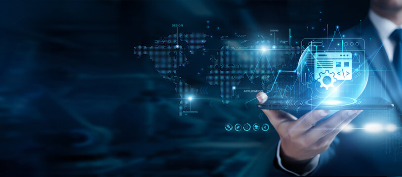 Businessman using the tab and analyzing software development data, coding workflow, application design, testing process, agile programming