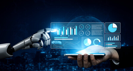 A robot hand reaches out to interact with digital data displayed above a human hand holding a smartphone, showcasing advancements in technology and analytics. Gantry