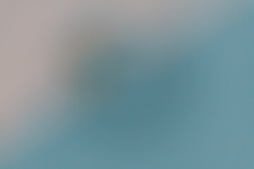 Abstract defocused gradient in cool blue and gray tones, creating a calm minimal background...