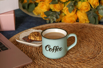 Cozy rustic coffee cup on woven straw surface with warm autumn decor, hygge still life, slow living morning concept. High quality photo