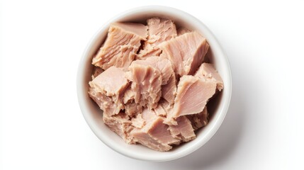Canned tuna chunks filling a white bowl, presenting a healthy and convenient seafood option rich in protein, ideal for various dietary needs and meal preparations