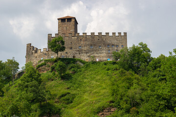 Obraz premium Castle of Zumelle, Italy, on green hill landscape