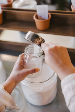 Hands Refilling Containers