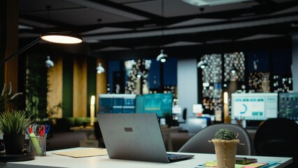 Empty business office at night showcasing data reports and analytics, midnight glow and lights in the company boardroom. Modern workspace with financial projections for management.