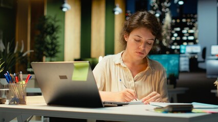 Corporate strategist ripping a paper after writing the wrong idea, restarting her work in rage and...