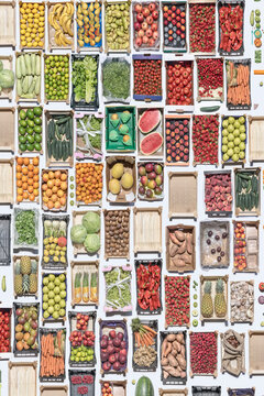 colorful fruity mosaic made of wooden crates with fruit