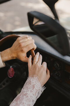Bride and Groom's Hands in Car