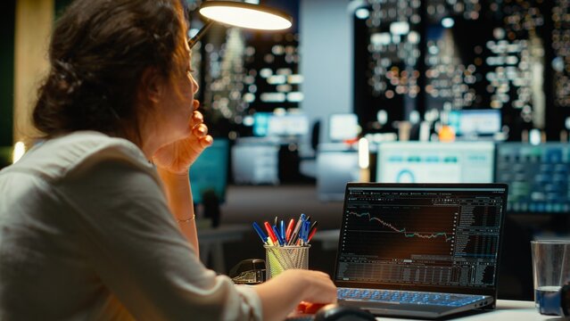 Devastated finance advisor looks at real time money loss and decreasing trends, stock crash causing concern for bankruptcy. Cryptocurrency market fall showcases a financial crisis. Camera B.
