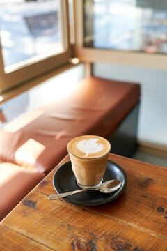 Warm latte coffee by the window