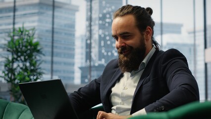 Satisfied entrepreneur cheering about a business success and achievement, reading some good news...