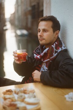 Man Enjoying Cocktail by Venice Canal &ndash; 35mm Film UGC Capture