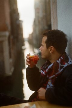 Man Enjoying Cocktail by Venice Canal &ndash; 35mm Film UGC Capture