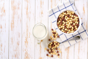 Making a healthy breakfast corn balls and chocolate corn balls and milk. Top view.