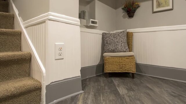 Medium shot of a remodeled basement corner with moistureresistant paint panels and coatings demonstrating combined protection and aesthetic appeal.