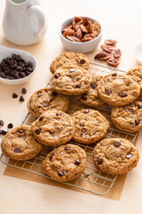 Chocolate chip cookies freshly baked on a cooling rack