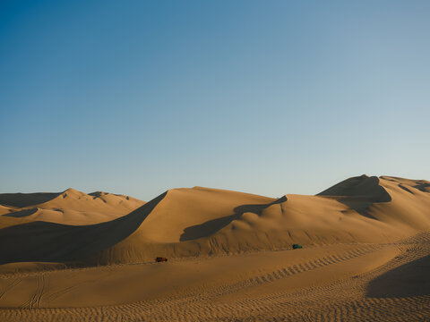 Buggy on sand dunes in the desert  